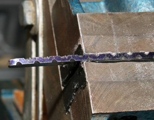 using halfround needlefile cut groove right next to u shape and same depth as round groove.