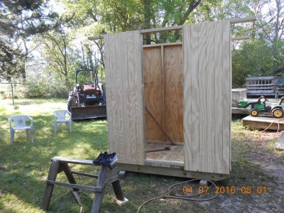 We got this far before they had to leave, but failed to get pictures of them measuring and marking the siding  before "sewing" up the siding with the little staple shootin' gun