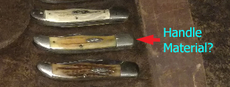 What is handle material of highlighted knife?