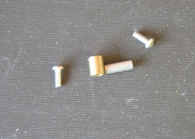 .125 ID - .1875 OD bronze phosphorous bushing and  1/8 OD pivot pin and 2-56 screws