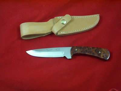 A W64 Western with Amboyna burl handles.