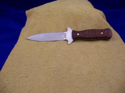A small Camillus boot knife in Snake Wood.
