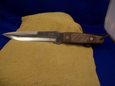 Camillus Close Quarter Battle (CQB) with canvas micarta handles. Not made to be pretty, made to be a work horse. I believe is is on it's way to Iraq.