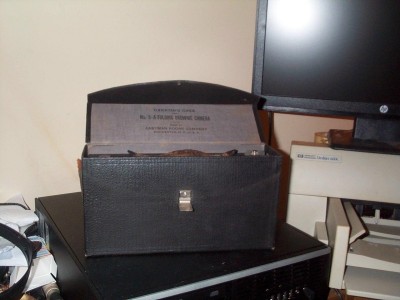 Camera in carrying case.Only damage is seen here: the carry strap is broken off.