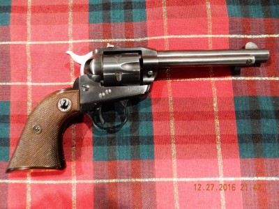 Old Model with red grip panels.