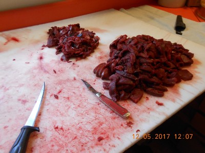 RR standing by after filet knife did its work.  Bigger pile is sliced about 1/4&quot; for frying, the small pile is the beginning of sausage