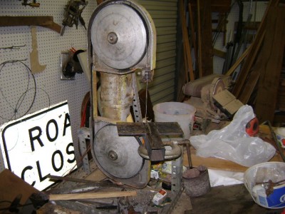 another belt sander in the background. I took the metal cuttin saw and put it on its end and made a rest around the blade for cutting.