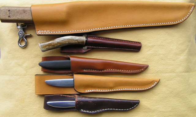 Top;Russell in new High rider. Next a special small steel in a custom carrier. 3rd a Bird and trout in original.4th new high sheath for miming.Last Pixie in original.