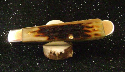 Case 2016 Mini-Trapper 6207 SS Jigged Molasses Bone - Closed Pile.JPG