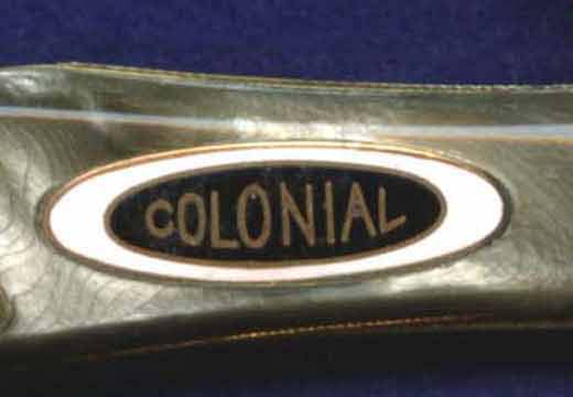 A Colonial shield on a Robeson marked, celluloid handled coke bottle jack. Colonial Trucking?