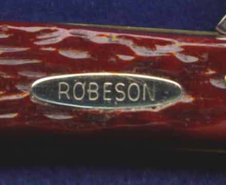 Nickel-silver oval Robeson shield used from early 1950's until 1965.