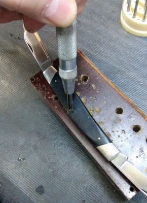 Knocking pin through frame w/ snap punch