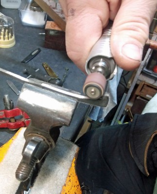 Sam the inside surface of the Springs to smooth them before polishing