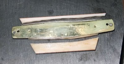 Bone glued to mark side handle and access cut off.