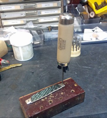 Tapering pivot pin holes with tapered reamer