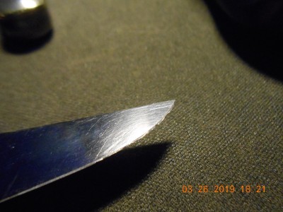 Dings on the blade from closing on the bail.