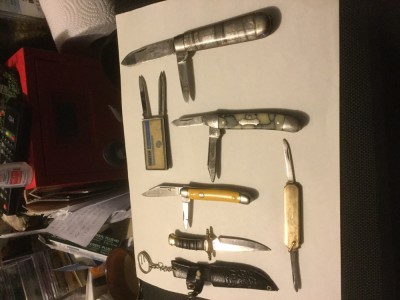 From left to right - a tiny fixed, with case. It seems pretty cheap but the blade is half decent and it was cute! It’ll go with my other two little ones. <br />Next is a cream celluloid Imperial in great shape. I really like the look of this one. <br />The mosaic Colonial has been yelling at me for a long time. I finally got it with the big grey and orange celluloid next to it. $5 off for taking both. <br />Oh yeah, the big guy. Thanks to being kindly bombed with three Richards a while back, I finally recognized it for what it was. One of my Bombs has the 30 on it, along with an explanation that Richards did sometimes fly incognito behind that no. 30. So, I actually knew what it was! <br />The top money clip/blade/file is from Domtar. Well then...since my Dad drove forklift for Domtar, a total of 23 years, I kind of had to give it a good home! <br />Finally, the little fob knife is nice for my growing side line in the little jewels. <br /><br />Not a bad day!