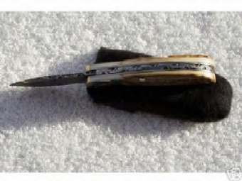 Gary DeBrock Damascus Friction Folder.jpg