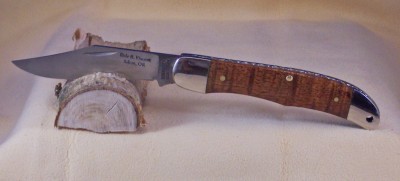 An SC524 with Koa wood handles and filed back spring