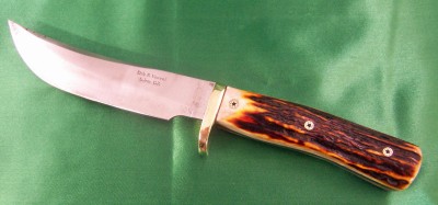 I did this 165OT in 2009 for Tongue River. It has Amber stag handles as I recall. Cal claims he still likes this knife.
