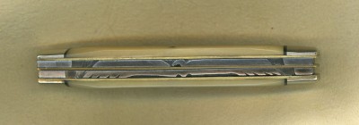 This is the file work on the back spring. It's an eagle, or a condor if you live in California. Not an easy pattern to file, though I have done a few of them. The older I get the more difficult they are to do.