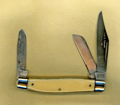 This is a 8OT with smooth ivory colored bone handles