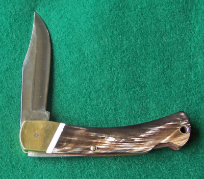 Pile side of a 6OT which was of course the prettiest. once I got it hafted. The handle is water Buffalo horn and fossilized ivory in the strip along the bolsters..