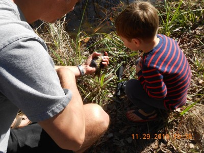 Fixin' to turn his fish back into the pond.