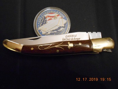 Knife and USS Constellation coin