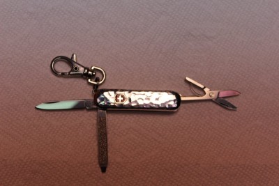 Three blade swiss army knife with silver scales.JPG