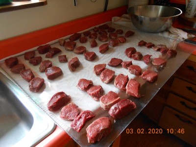 Boneless venison chops ready for packaging and vaccuming.  Nothing but pure, wonderful, wild meat!  No bone, no sinew, no silver skin, just good healthy red meat, all cut and trimmed with a knife.  No offence intended to any vegans who might see this.