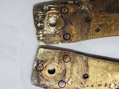 Close up of pivot hole from liner side. Looks like bushings in center of hole.