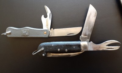 The lower &quot;Navy&quot; knife has an old school can opener and no cap lifter, despite the fact that these are post WW2 (I think). Also, the marlin spike on these things are unusually sharp.