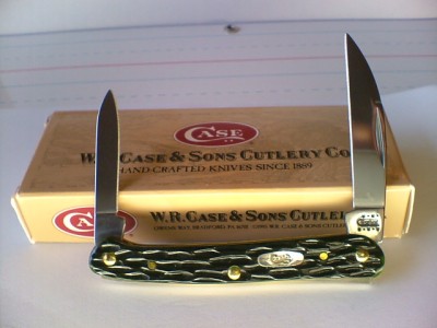 P30F  2001 #2938 62109W MINI-COPPERHEAD HUNTER GREEN PINE BARK JIGGED SHADOW BONE.JPG