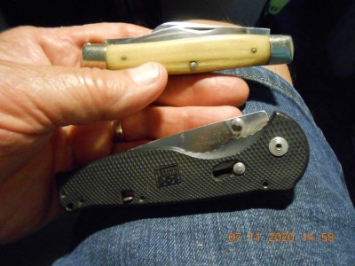 The SOG is an ugly sucker but it opens with one hand  <br /> and is very handy around the farm.  In the other pocket was my old #49 Queen.  No need to stress a good knife for such a menial task as cuttin' a grape vine's throat.