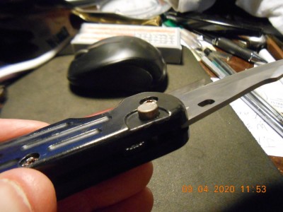 Push button to fire the blade and also unlocks it to close.