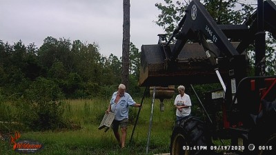 Ladder to allow me to hook chain on top of feeder tripod, wading in the water.  Miss Joy had rubber boots I'm wearing my summer service A flip flops.