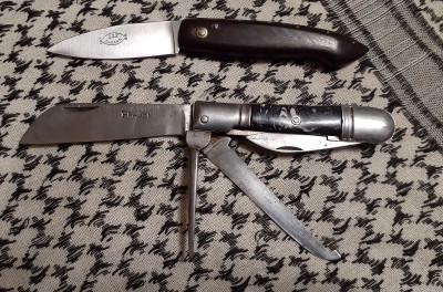 Above is a Capucin style friction folder marked 222 Garanti. I think that brand is owned by Thiers Issard. Below is a 4 piece Sailor's knife by Pradel, with steel bolsters and marble-colored plastic scales.