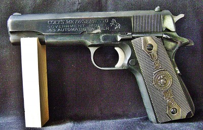 Colt 1911 with USMC Grips.JPG