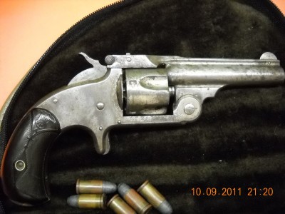 .32 S&amp;W model 1 1/2  Tight little revolver, most of nickle finish is gone and both grips have a small piece missing at the butt.