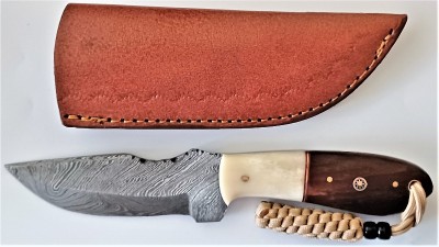 Handcrafted Damascus Steel with Wood/Bone handle.