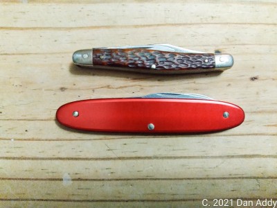 Ka-Bar And Wenger Pile Sides.jpg