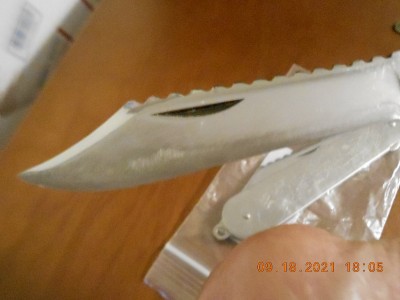 Notice the unsightly scratches way up on the blade.
