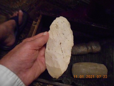 Probably an ax or club head, flint or chert?