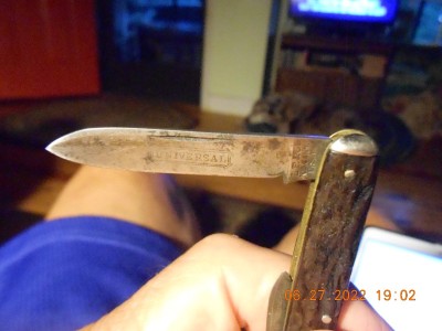 Still has the UNIVERSAL etch L F &amp; C pen knife  I think it has rough black handles.  It does have half stops and still really snaps on the large blade.