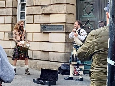 Street musicians performing in Edinburgh