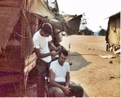 Jerry Downen cutting Dennis Hollis's hair late '65.jpg