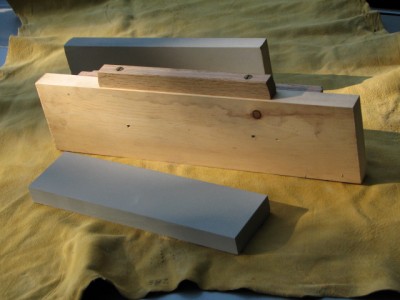 Oak piece on bottom edge is removed and secured to bottom for placement in vice