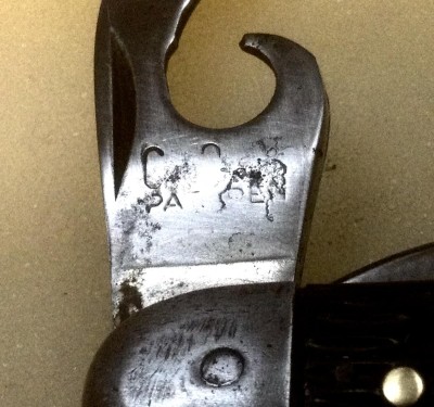 The Can Opener Front Tang Stamp.