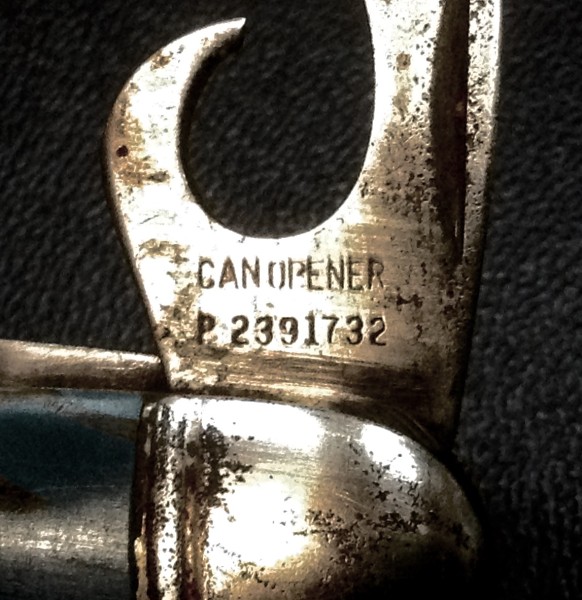 The Can Opener Front Tang Stamp.